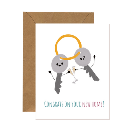 Whimsical greeting card for a friend’s big move to a new home, featuring an illustration of two smiling keys on a keyring toasting with champagne.